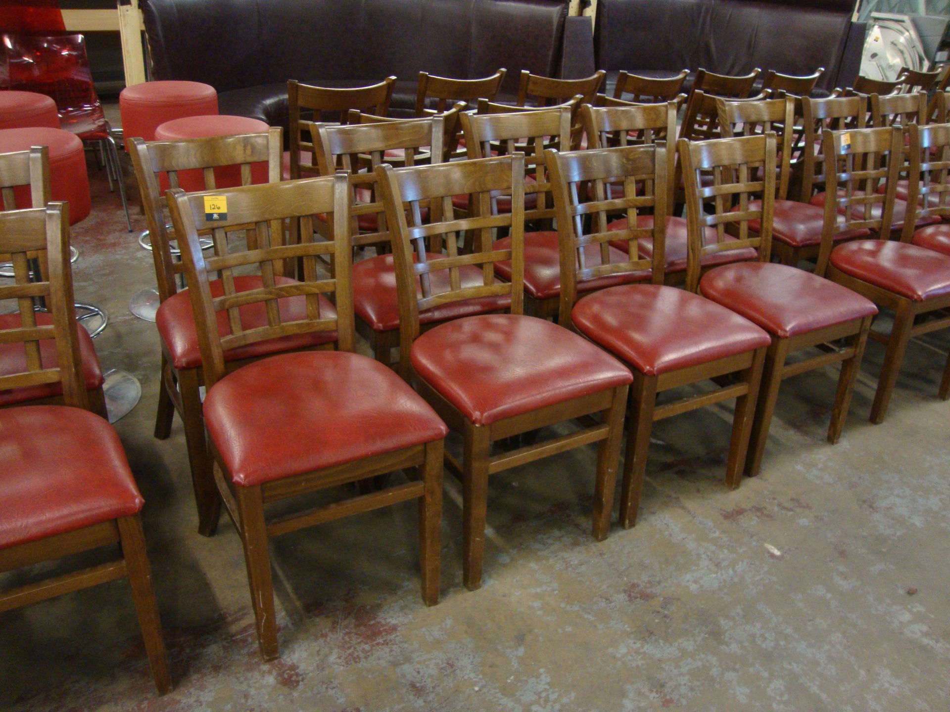 8 off wooden chairs with red upholstered bases. NB lots 121 – 129 consist of different quantities of