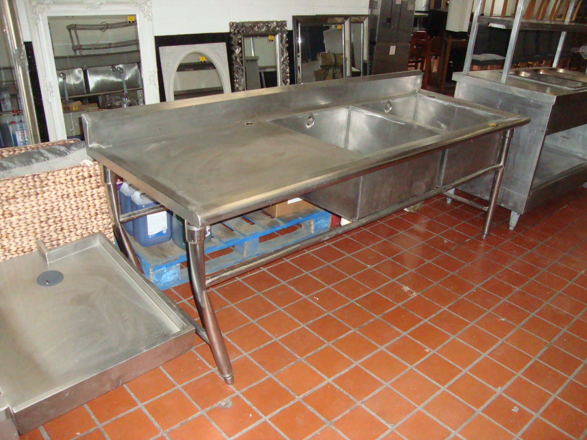 Large freestanding stainless steel twin bowl sink with max dimensions circa 87" x 31.5" x 37"
