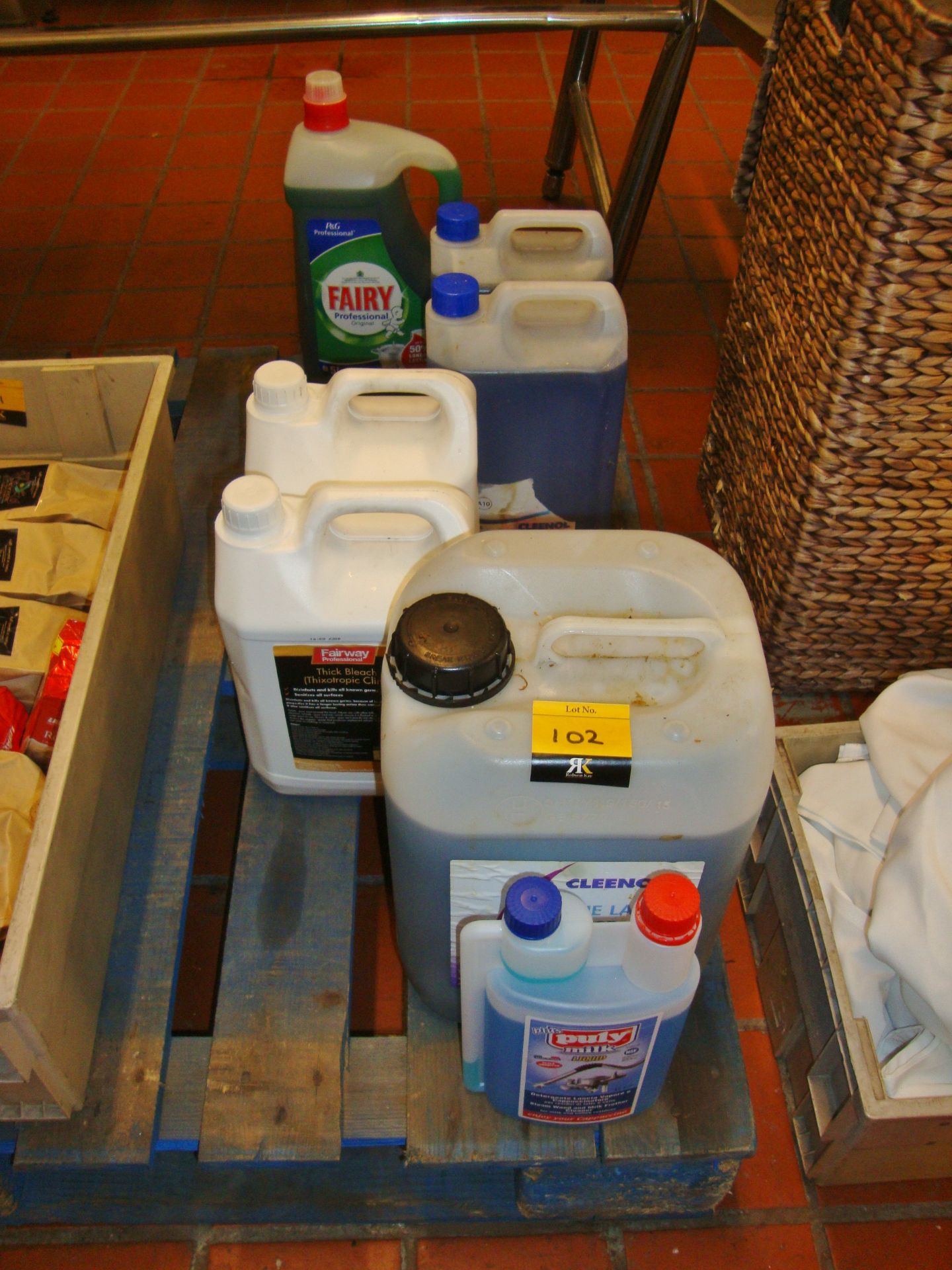 Row of assorted cleaning fluids & related items