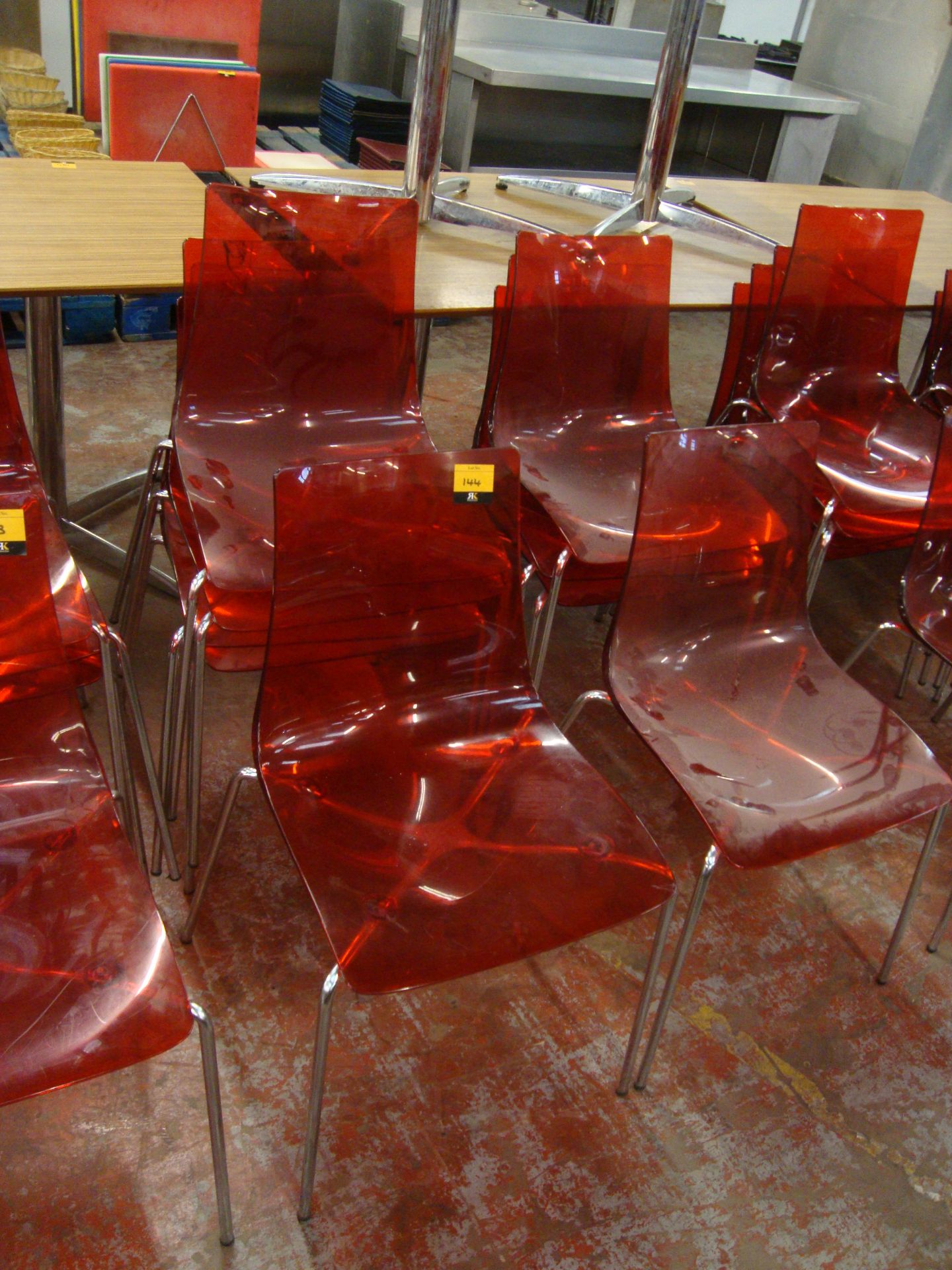 9 off matching red clear plastic chairs on metal legs. NB lots 138 - 145 consist of different