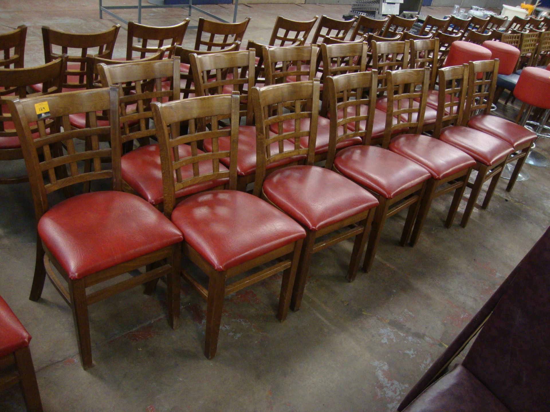 13 off wooden chairs with red upholstered bases. NB lots 121 – 129 consist of different quantities