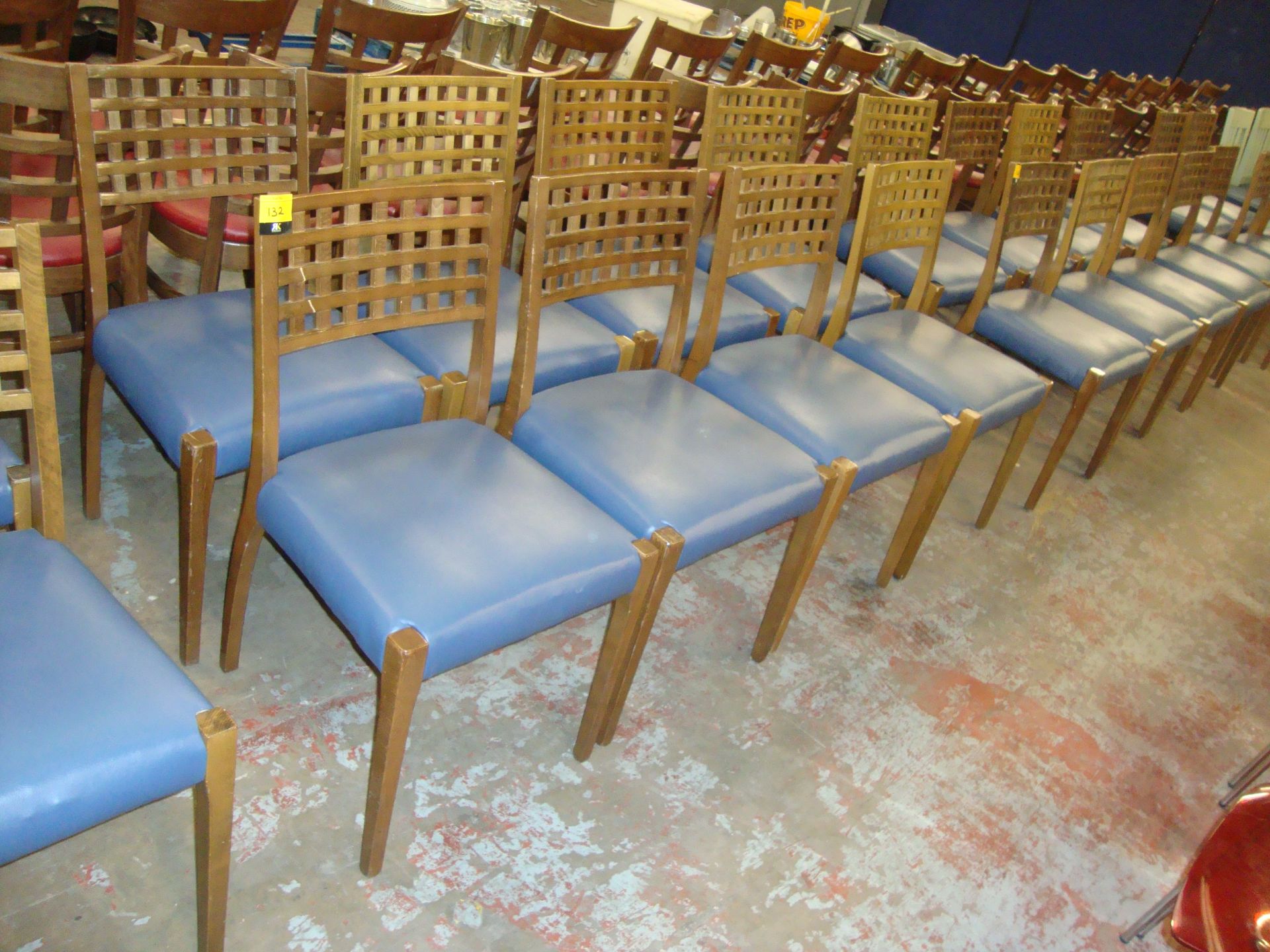 8 off matching wooden chairs with blue upholstered seat bases. NB lots 131 - 137 consist of chairs