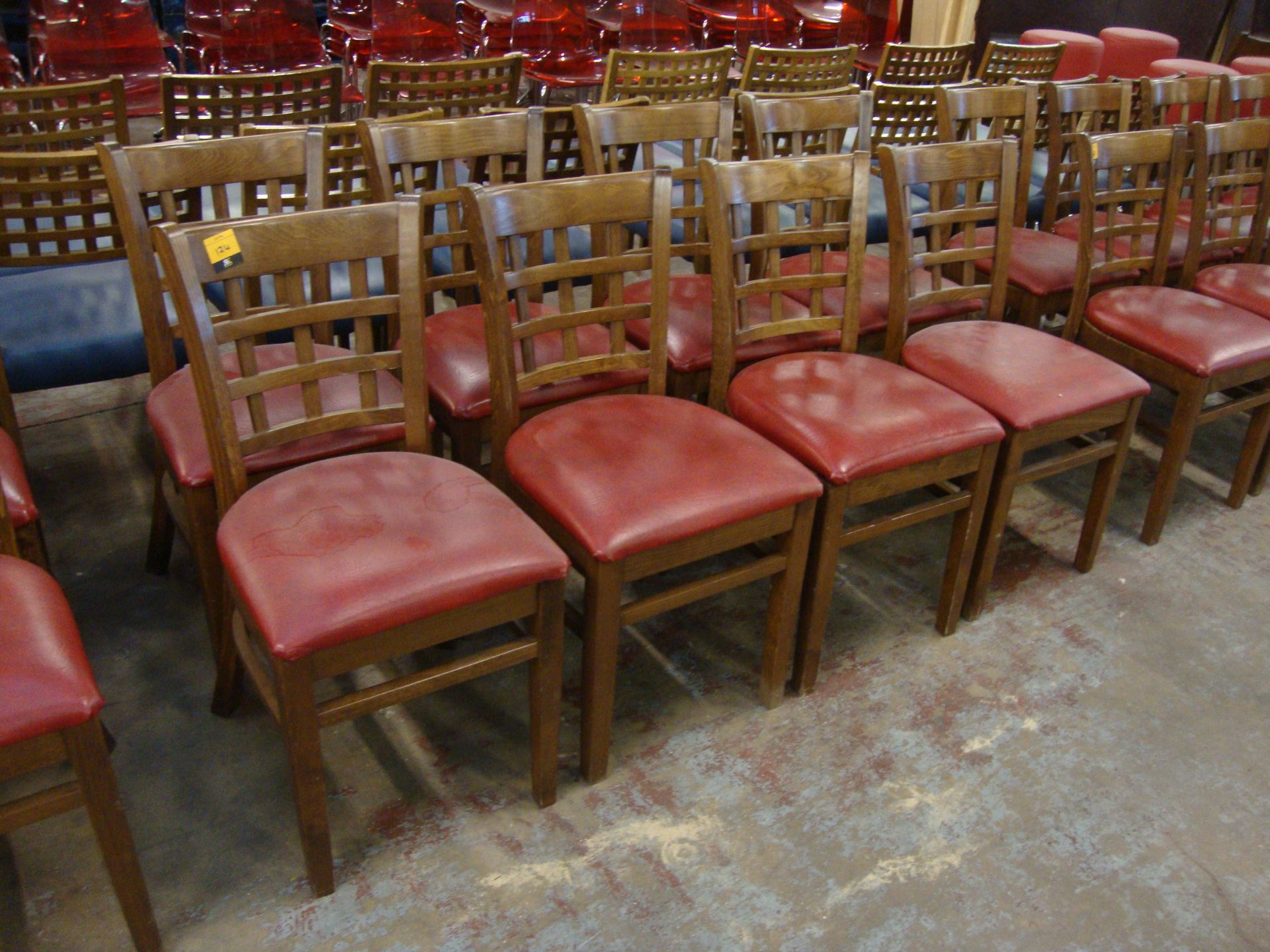 8 off wooden chairs with red upholstered bases. NB lots 121 – 129 consist of different quantities of