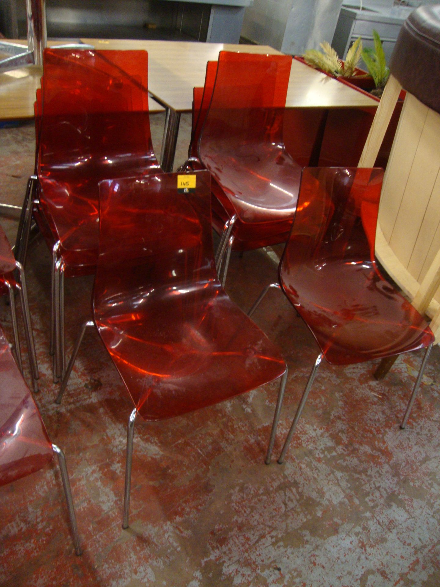 10 off matching red clear plastic chairs on metal legs. NB lots 138 - 145 consist of different