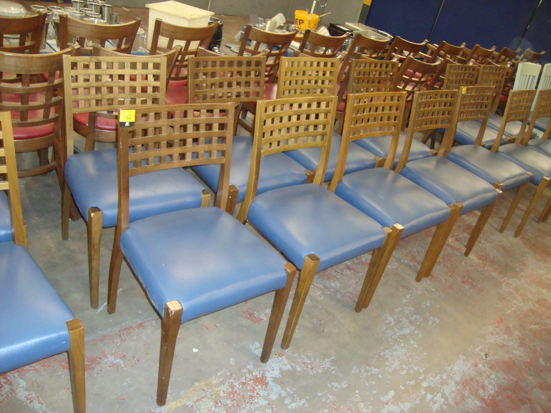 8 off matching wooden chairs with blue upholstered seat bases. NB lots 131 - 137 consist of chairs