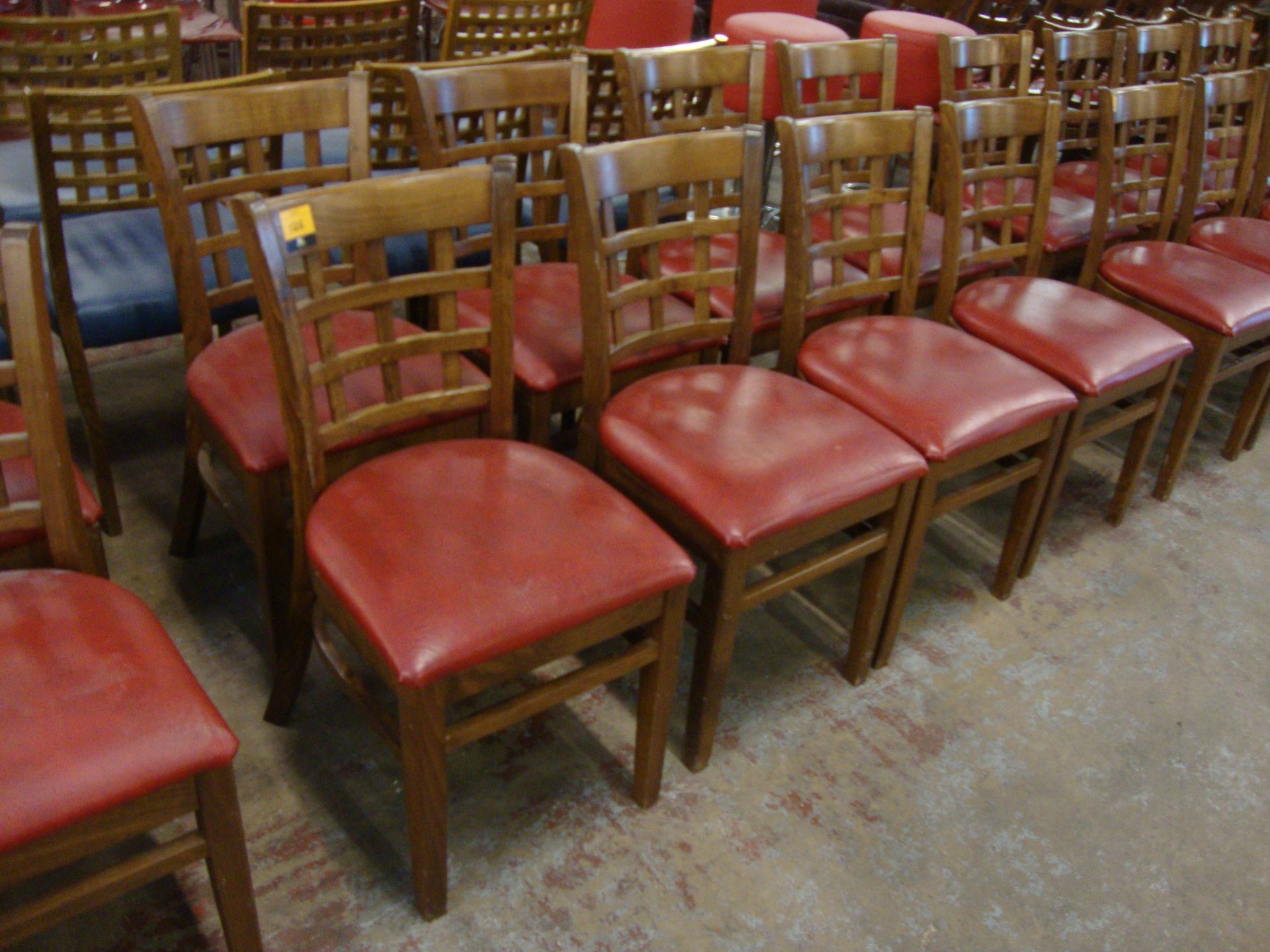 8 off wooden chairs with red upholstered bases. NB lots 121 – 129 consist of different quantities of