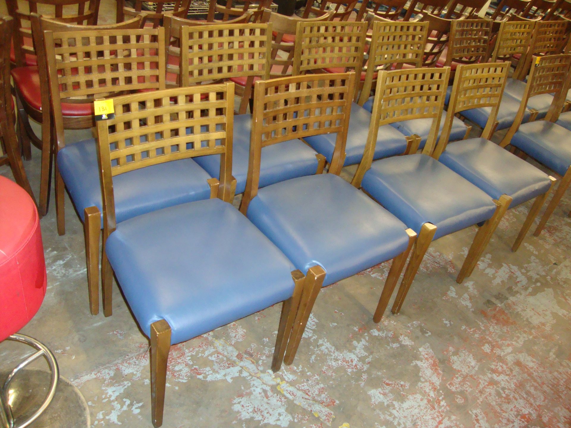 8 off matching wooden chairs with blue upholstered seat bases. NB lots 131 - 137 consist of chairs