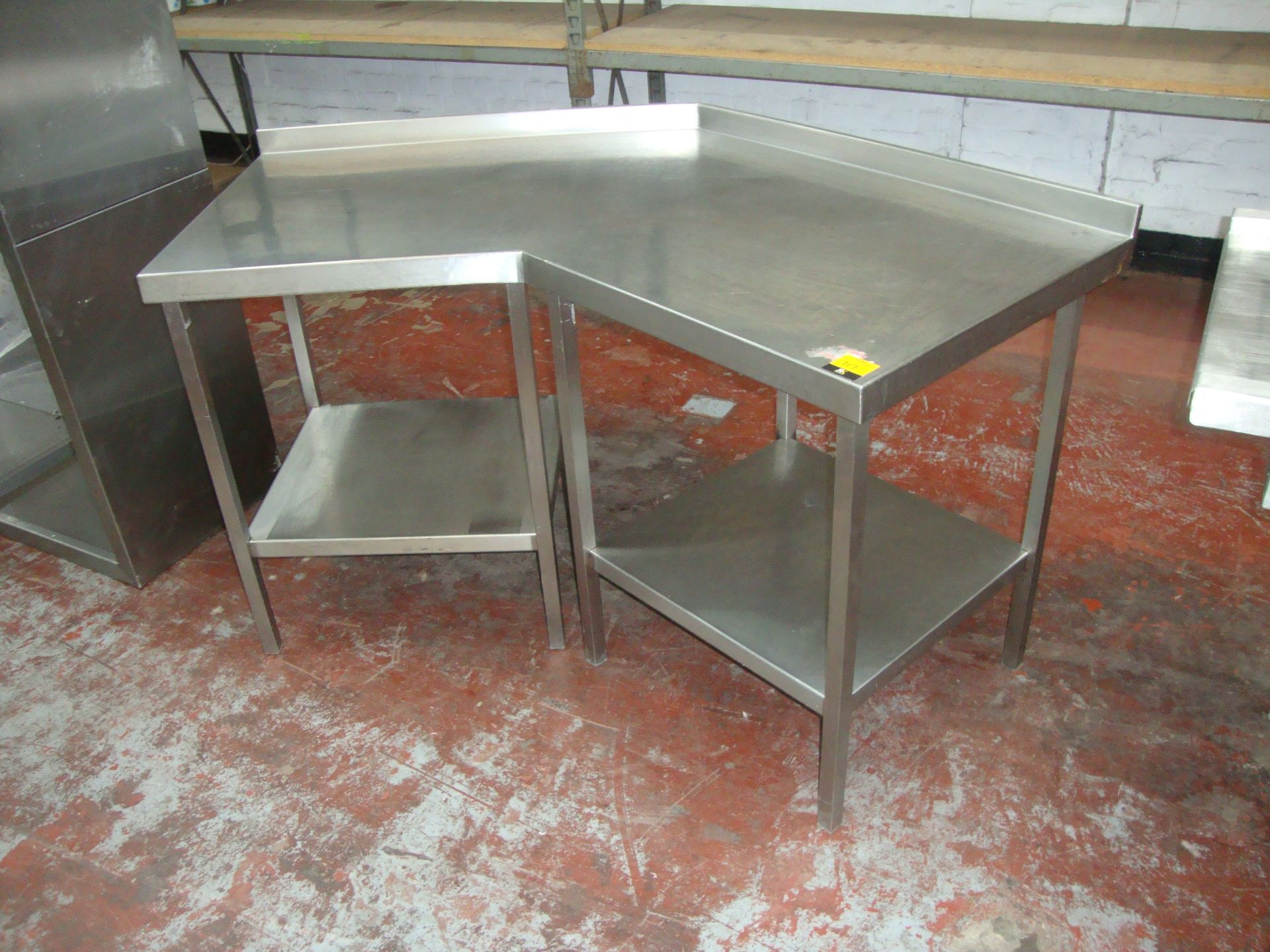 Unusual angular stainless steel twin tier table arrangementIMPORTANT: Please remember goods