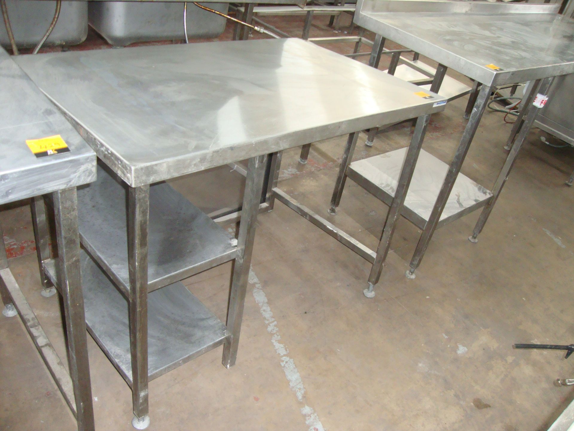 Stainless steel table with a series of narrow shelves below same circa 1100mm x 700mmIMPORTANT: - Image 2 of 2