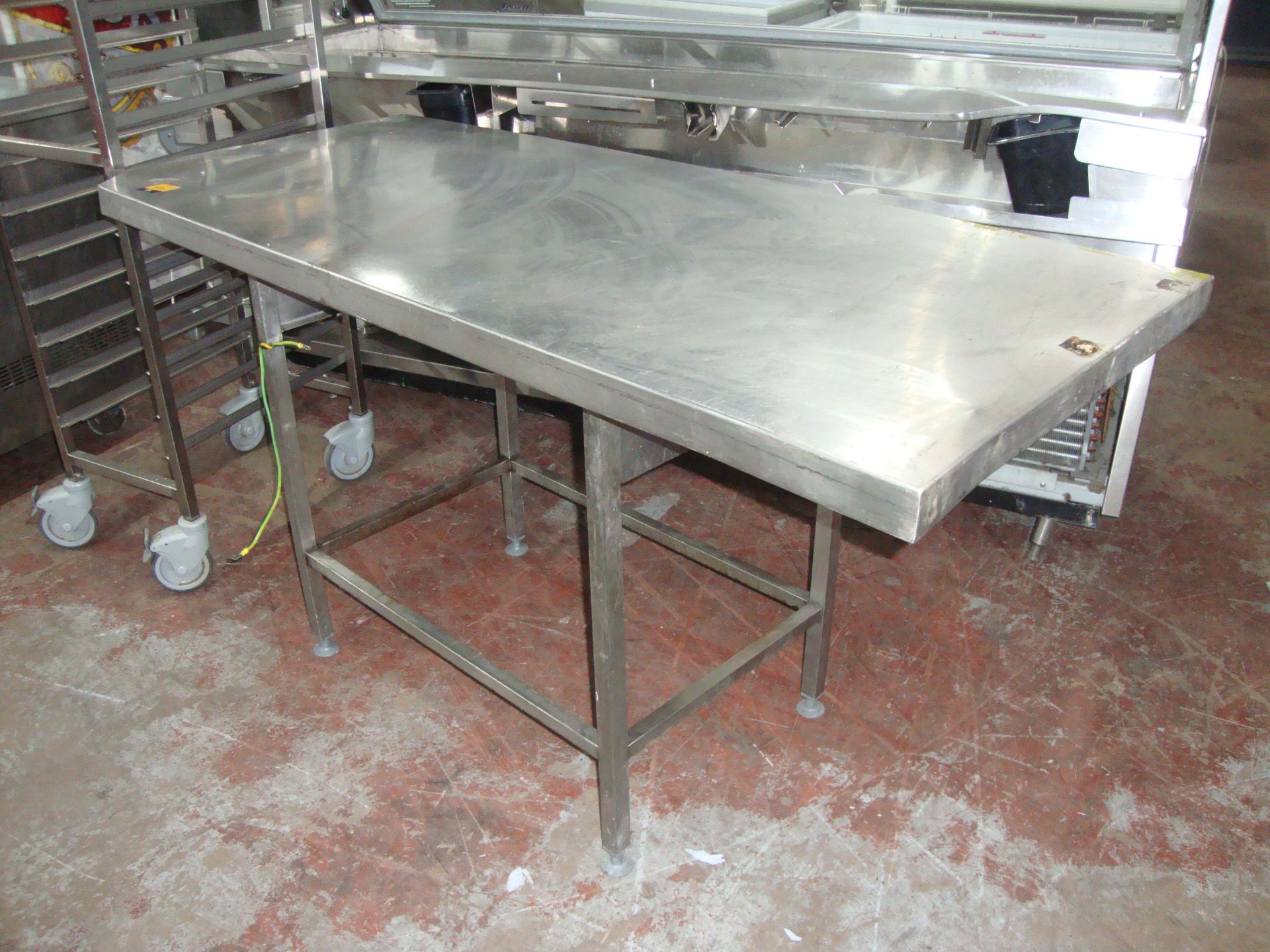 Stainless steel table with dimensions of top being circa 1600 x 700IMPORTANT: Please remember