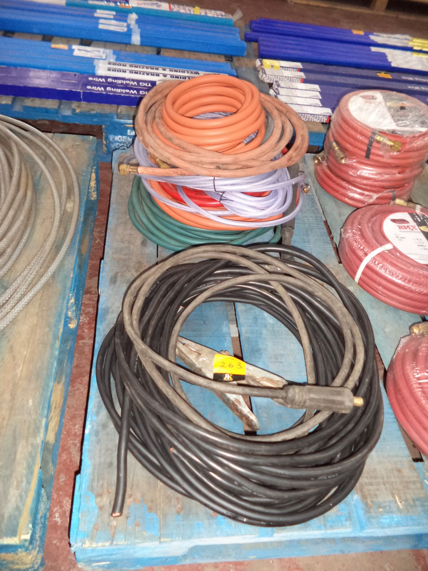 Row of assorted welding hose & related items IMPORTANT: Please remember goods successfully bid