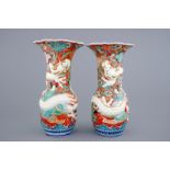 A tall pair of Japanese relief-moulded dragon vases, 19th C. - H.: 55 cm -
