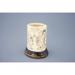 A Japanese carved and signed ivory brushpot on gilt-lacquered stand, Meiji, 19th C. - [...]