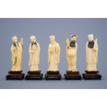 A set of 5 Chinese carved ivory figures of immortals on wooden bases, 19th C. - Dim.: [...]