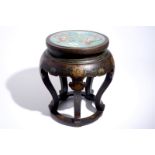 A Chinese lacquered wood and cloisonne stand, 20th C. Dia.: 48 cm - H.: 52,5 cm Condition reports