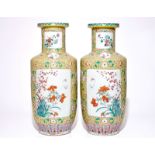 A pair of large Chinese yellow ground famille rose vases, 19/20th C. H.: 79 cm Condition reports and