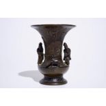 A Chinese bronze vase with applied figures, 19th C. H.: 18 cm Condition reports and high