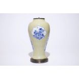 A Chinese blue and white on carved celadon-glazed ground vase, mounted as lamp, Kangxi H.: 41 cm