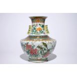 A large Chinese famille rose hu-shaped vase with birds among flowers, Qianlong mark, 19th C. H.: