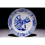 A Chinese blue and white plate with figures in the garden, Kangxi mark and of the period Dia.: 21 cm