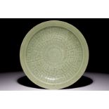 A Chinese celadon dish with incised lotus design, 19th C. Dia.: 29 cm Condition reports and high