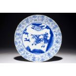 A Chinese blue and white fluted plate with a hunting scene, Kangxi Dia.: 24,5 cm Condition reports