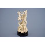 A Chinese carved ivory group of the moon goddess and two girls on a wooden base, 19/20th C. Dim.: