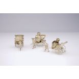 A Chinese silver rickshaw-shaped pepper and salt shaker and a mustard container, 19th C. L.: 11,5 cm