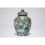 A Chinese verte biscuit covered jar with horses, Kangxi H.: 13 cm Condition reports and high