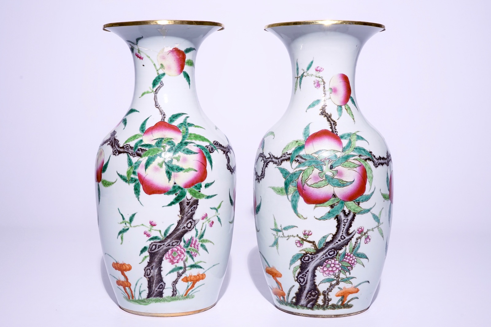 A pair of Chinese famille rose "nine peaches" vases, 19th C. H.: 43 cm Condition reports and high