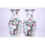 A pair of Chinese famille rose "nine peaches" vases, 19th C. H.: 43 cm Condition reports and high