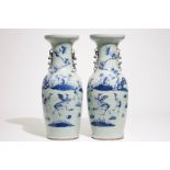 A pair of Chinese vases in blue and white on celadon ground with cranes, 19th C. H.: 61 cm Condition