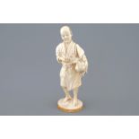 A Japanese ivory okimono of a chicken farmer, Meiji, 19th C., signed H.: 20,5 cm Condition reports