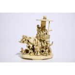 A fine Japanese ivory okimono of boys playing with an elephant, Meiji, 19th C., signed H.: 15cm, the