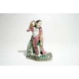 A Chinese famille rose figure of Liu Hai with the toad, 20th C. H.: 25,5 cm Condition reports and