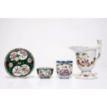 A Chinese famille rose jug, a cup and saucer and another cup with ear, 18th C. L.: 15,5 cm - H.: