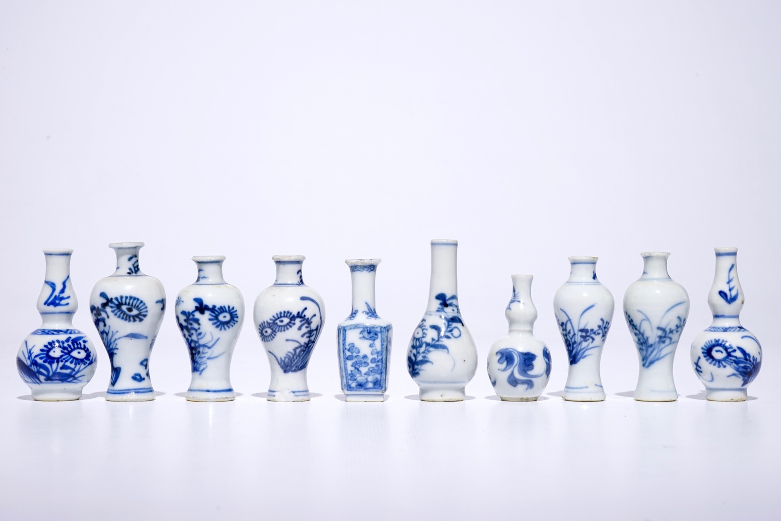 Ten Chinese blue and white miniature dolls house vases, mostly Kangxi H.: 7 cm (the tallest)