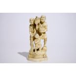 A Japanese ivory okimono of bird catchers, Meiji, early 20th C., signed H.: 19 cm Condition