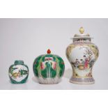 Two Chinese famille rose vases and covers and a small covered famille verte ginger jar, 19/20th C.