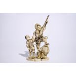 A Japanese ivory okimono of a hunter and his son, Meiji, late 19th C., signed Dim.: 28 (h) x 16 x 11