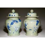 A pair of Chinese celadon, copper-red and underglaze blue vases and covers, Kangxi H.: 32 cm (