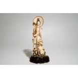 A Japanese ivory model of Guanyin on a carp, Taisho, ca. 1930, signed Dim.: 33 x 14,5 x 9 cm