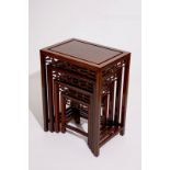 A set of four Chinese sculpted hardwood stacking tables, 20th C. H.: 66 cm - L.: 50,5 cm - W.: 35,