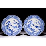 A pair of Chinese blue and white plates with animals in a garden, Qianlong Dia.: 22,5 cm Condition