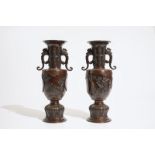A pair of Japanese bronze relief-decorated vases, Meiji, 19th C. H.: 37 cm Condition reports and