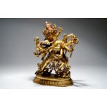 A Sino-Tibetan gilt bronze figure of Chakrasamvara, 17/18th C. Dim.: 31,5 (h) x 26 x 14 cm