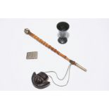 A Chinese bamboo opium pipe, a dark hardstone chalice and a silver belt buckle, 19/20th C. L.: 59 cm