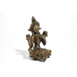 A Sino-Tibetan gilt bronze figure of Green Tara (Syamatara), 17/18th C. Dim.: 15 x 9,5 x 11 cm