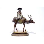 A large Chinese bronze and cloisonne model of Shou Lao on a deer, on wooden base, 19/20th C. Dim.: