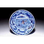 A rare Chinese blue and underglaze red bowl with carps and marine animals, Kangxi mark and of the